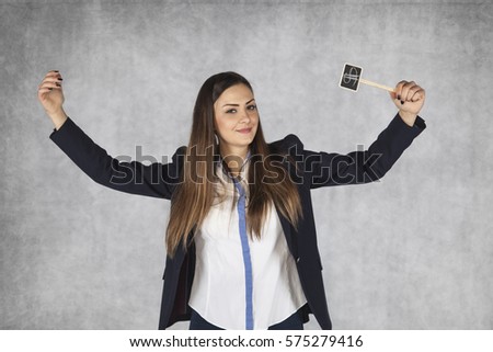 business woman with dollar signs raises her hands in a gesture of success