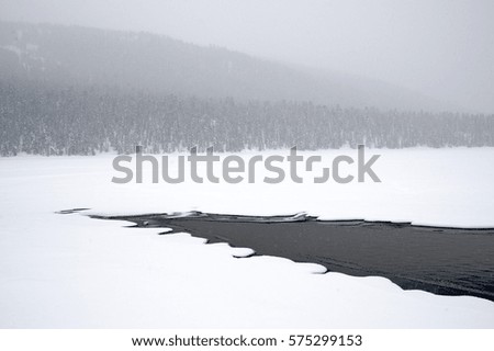 Unfrozen mountain river with blue water, Russia