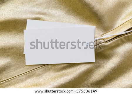 Tags on a Gold Leather Jacket with Zipper