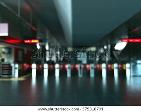 blurred background : view of passenger gate in a train station