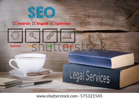SEO concept. Stack of books on wooden desk