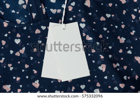 Tags on a Blue Cotton Blouse with Print Heart