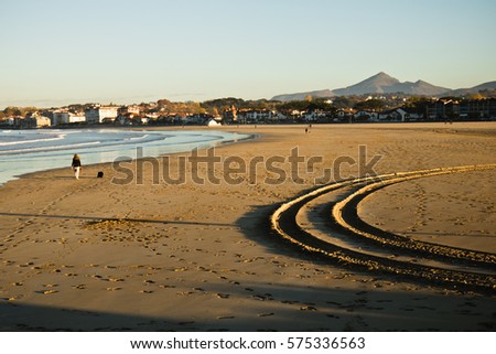stunning landscape with sandy beach of hendaye on a sunny day with mountain la rhune in the back, basque country, france