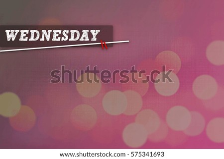 WEDNESDAY text on pink abstract background