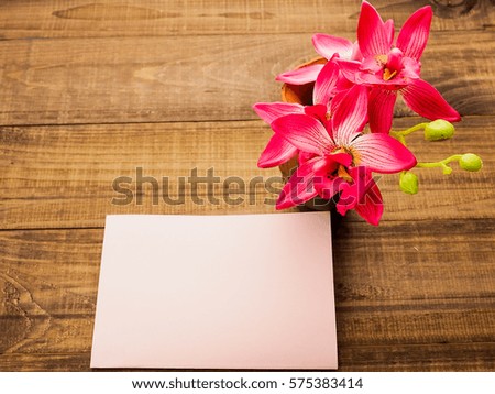 Blank present Valentine card on wooden background