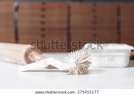 pizza coocking tools and utensils at wooden table