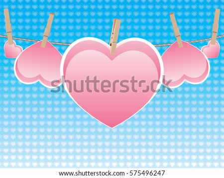 Colorful heart on a rope with wooden pegs.