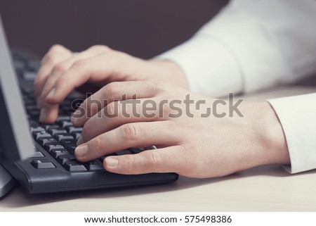 Man working on a computer in office