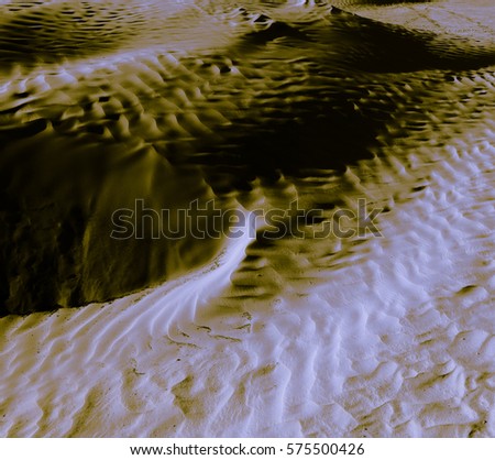Metal tin-sandy texture of cold desert. Wild nature