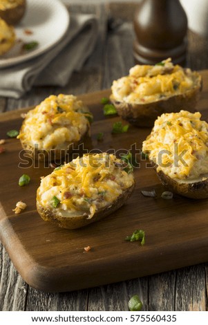 Homemade Twice Baked Potatoes with Bacon and Cheese Royalty-Free Stock Photo #575560435