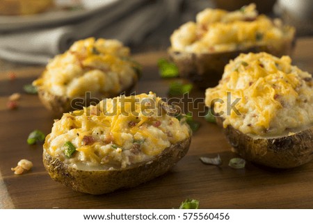 Homemade Twice Baked Potatoes with Bacon and Cheese Royalty-Free Stock Photo #575560456