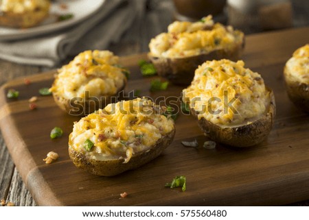Homemade Twice Baked Potatoes with Bacon and Cheese Royalty-Free Stock Photo #575560480