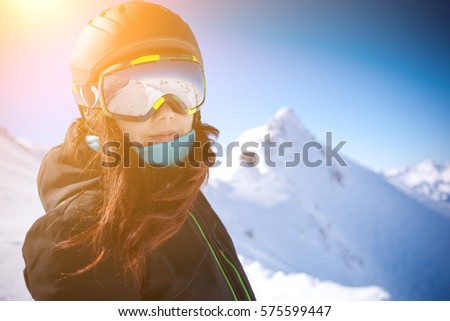Woman in helmet among mountains