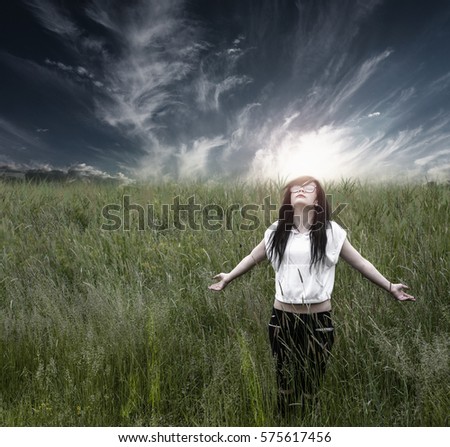 Emo girl stands and loves life with a sense of freedom, dramatic photo