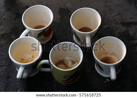 Five Empty Tea Cups in Random Arrangement
