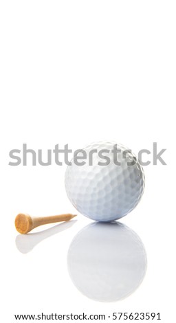 Golf ball and wooden tee over white background