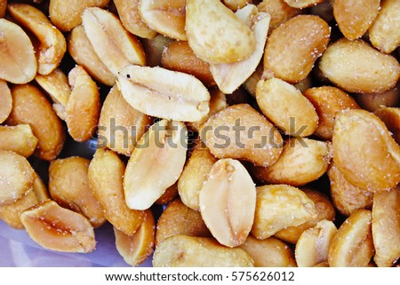 Peeled peanuts background food photography in studio. Close up macro peanuts photo. Beautiful salted roasted peanuts pattern concept. Nuts texture.