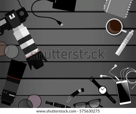 Workspace of photographer. Top view with gray table, photo camera, lens, smartphone, notepad and portable hard drive. Flat design. Vector illustration with clipping mask.