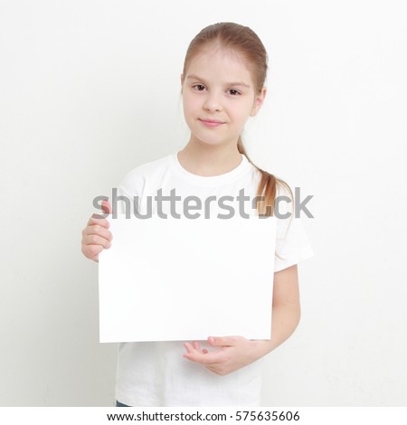 little girl holding empty white blank