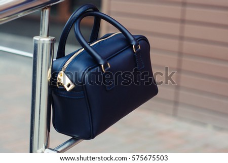 fashionable black handbag in the city