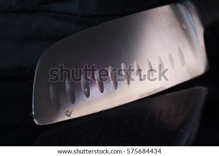 Close up photo kitchen knife with reflection 