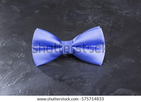 Bow tie light blue color on a background of gray marble / Bow tie light blue color on a background of gray marble / Nadale