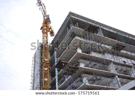 Building construction with crane Royalty-Free Stock Photo #575719561