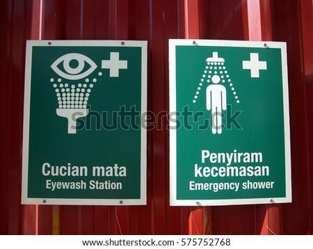 Emergency station and emergency shower signage in bilingual language Malay and English. 