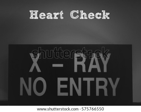 Heart Check : Words typed over the classic Black and white image of X-Ray and No Entry words sign on the wall. Conceptual healthcare medical service consultation or education healthy lifestyle.