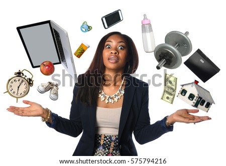 African American businesswoman juggling many objects and feeling overwhelmed Royalty-Free Stock Photo #575794216