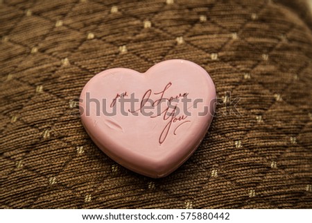 piece of soap in the form of heart with the inscription "I love you"