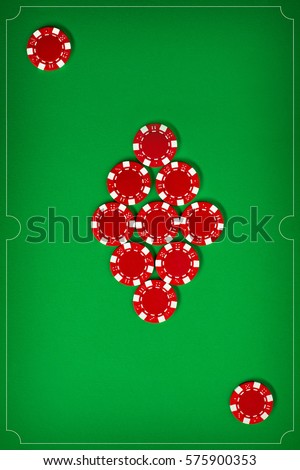 The poker chips on green background