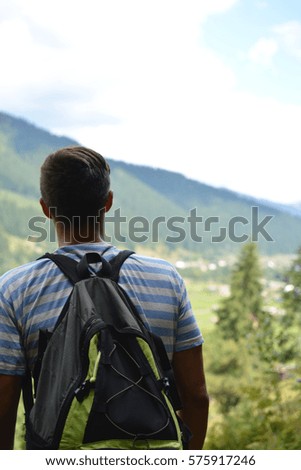 young guy looks  Royalty-Free Stock Photo #575917246