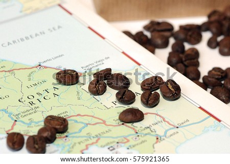 Coffee beans and map Royalty-Free Stock Photo #575921365