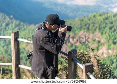 Photographer taking photo of amazing landscape.
