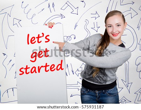 Young woman holding whiteboard with writing word: let's get started. Technology, internet, business and marketing.