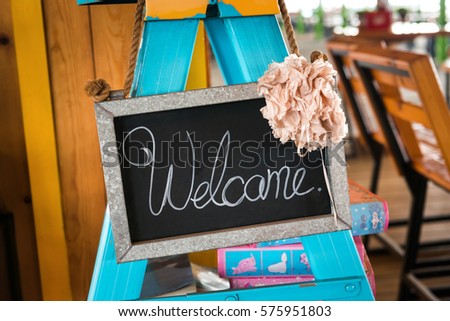 Welcome Sign , selective focus of welcome sign hanging on ceiling