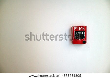 Fire alarm notifier on white wall