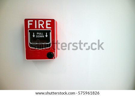 Fire alarm notifier on white wall