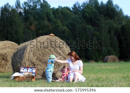 mother with twins in field