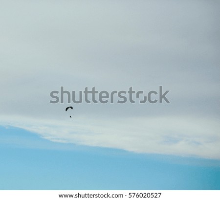 Small glider's figure in the celestial expanse