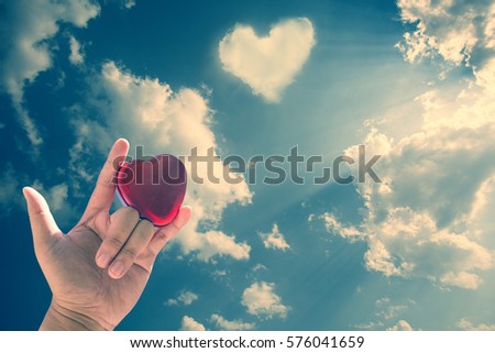 symbol sign language. Tell symbol by hand . vintage style. Heart with background sky. Royalty-Free Stock Photo #576041659