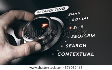 Hand turning a button with the title retargeting and 6 options, black background. Online advertising and behavioral remarketing concept. Composite between a photography and a 3D background.