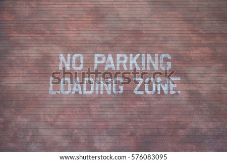 NO PARKING LOADING ZONE SIGN ON OLD ORANGE BRICK WALL