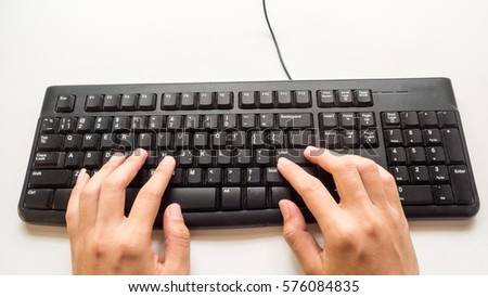 keyboard with hand on white background