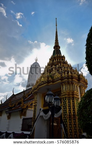 Thai style roof of sanctuary and pagoda with blue sky cloud, Temple of the Golden Bell, Bangkok, central of Thailand

