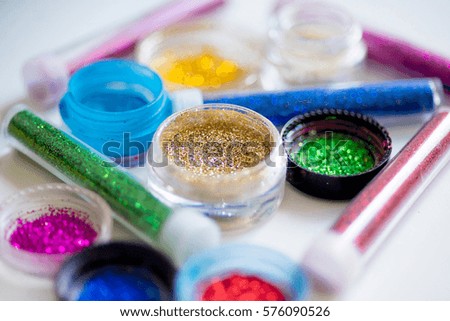 sequins in tubes makeup