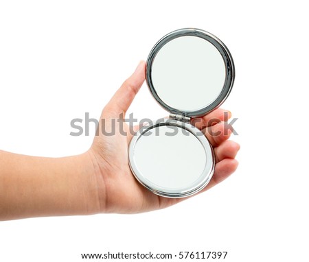hand holding cosmetic mirror isolated on white Royalty-Free Stock Photo #576117397