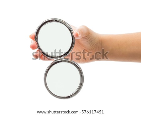 hand holding cosmetic mirror isolated on white Royalty-Free Stock Photo #576117451