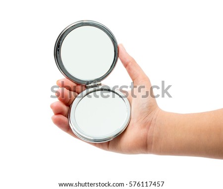 hand holding cosmetic mirror isolated on white Royalty-Free Stock Photo #576117457